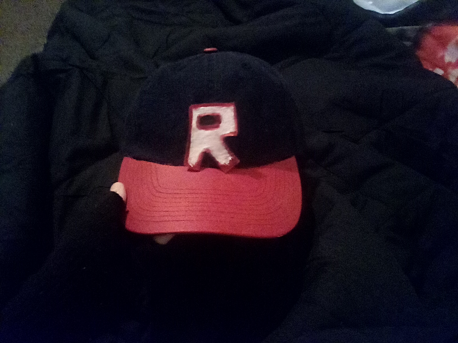 the roblox r baseball cap. but like. in real life